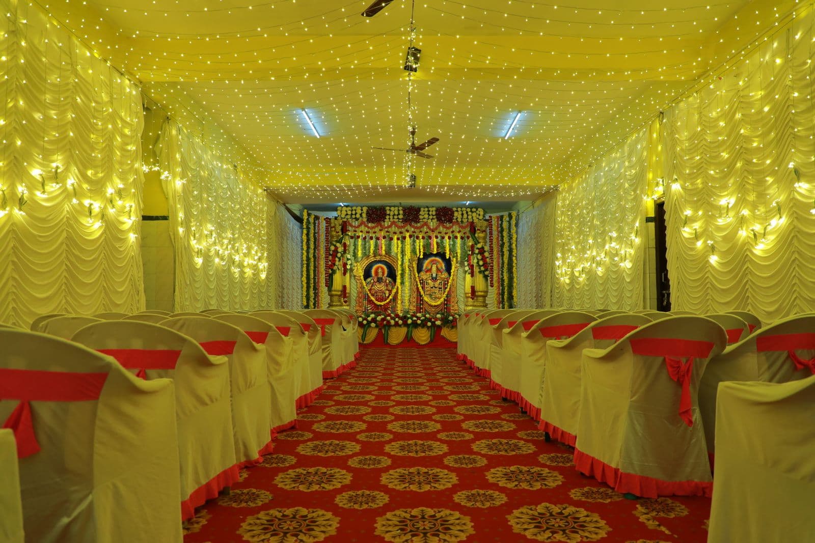 Rows of chairs with sashes ready for guests