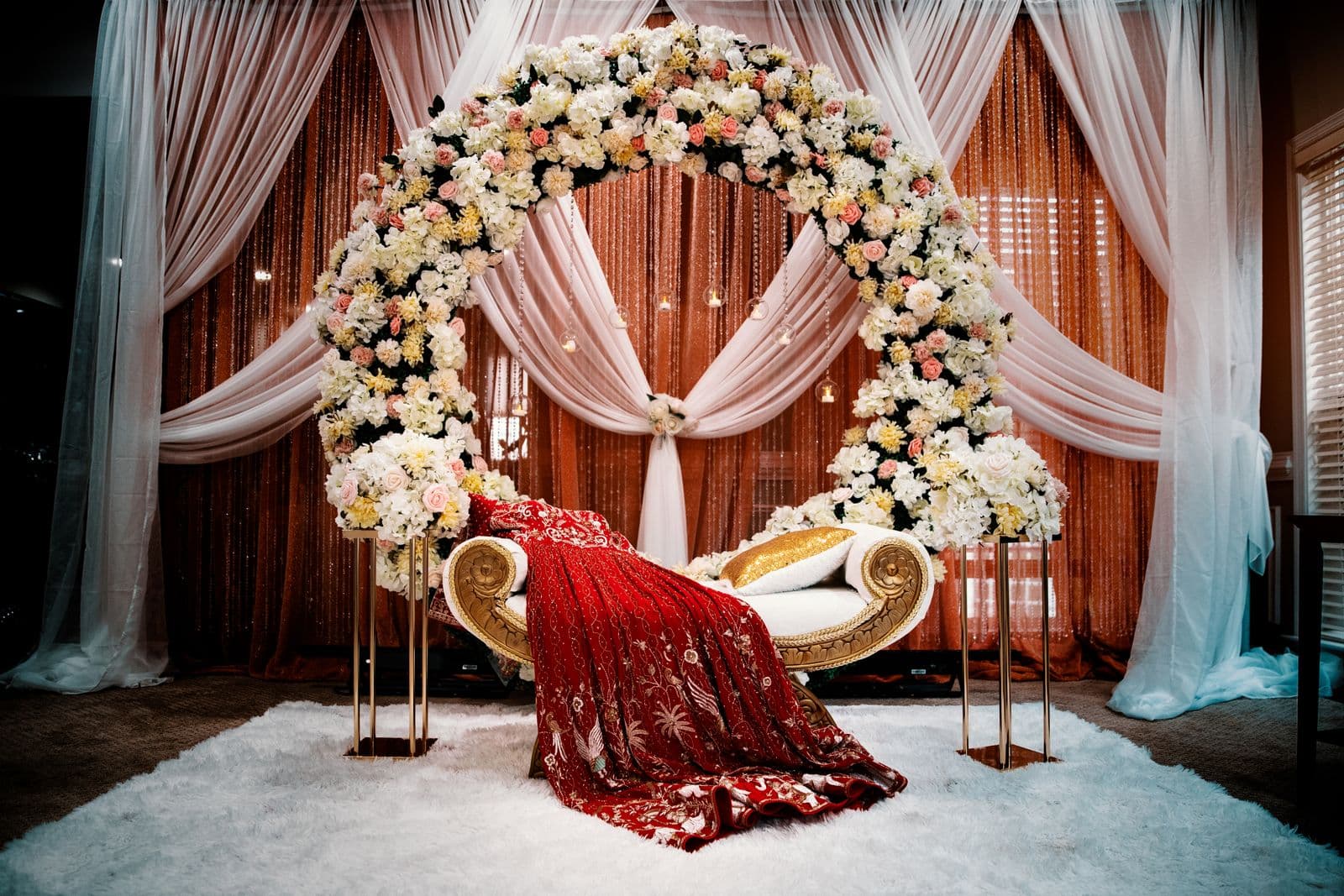 Stage decorated with a floral arch